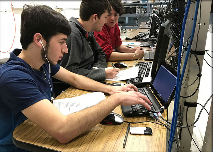 Students creating web apps in a programing class